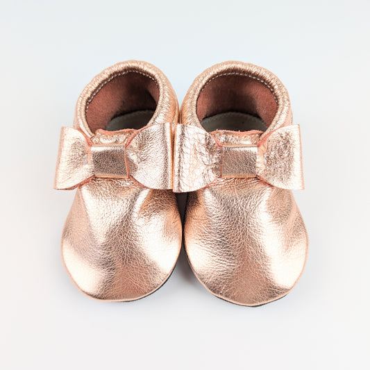 RTS Rose Gold Bow Moccs With Black Soft Rubber Soles - Size 4 (18-24M)(5.5")